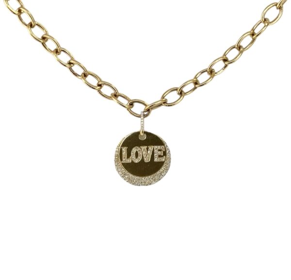 Chunky yellow gold necklace with a circle medallion charm featuring diamond accents and the word ‘LOVE’ spelled in diamonds — luxurious and meaningful fine jewelry by LA brand Neshi.