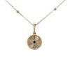 Gold necklace with a round sunburst medallion pendant featuring a pavé evil eye center and small beaded chain accents, shown on a white background.