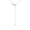 Elegant floral lariat necklace with delicate flowers cascading down to a single bloom, featuring a sparkling diamond at its center — timeless and sophisticated design.