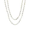 Double-wrap necklace featuring mini cross-shaped freshwater pearls in white with a hint of silver, styled for a layered, bohemian-inspired look.