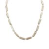 Freshwater pearl necklace featuring radiant white pearls and a sleek silver clasp, styled for a chic and carefree island-inspired look.