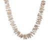 Choker necklace with glossy, white stick-shaped freshwater pearls and a silver clasp, offering a fresh, elegant touch perfect for summer.