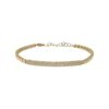 Bracelet/bangle featuring a sleek diamond bar at the center, surrounded by gold circles, available in yellow or white gold for a modern, elegant design.