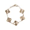 Bracelet featuring five gold flower charms, each with a diamond-accented center, linked along a fine chain for a delicate, nature-inspired design.