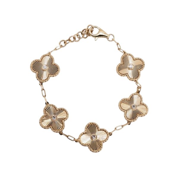 Bracelet featuring five gold flower charms, each with a diamond-accented center, linked along a fine chain for a delicate, nature-inspired design.