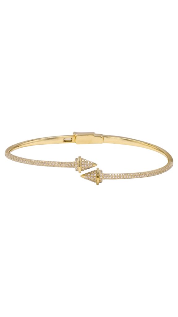Yellow gold bangle with an open-ended design, featuring two pointed cone-shaped ends, each accented with small diamonds.
