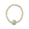 Stretch bracelet with round freshwater pearls and a large central coin pearl, photographed on a white background.