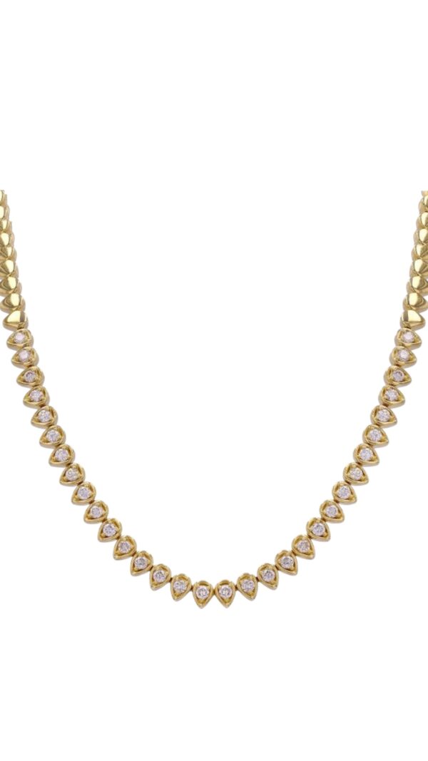 Gold necklace with teardrop-shaped bezels, each set with a round-cut diamond-like stone, displayed on a white background.